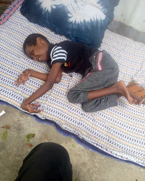 Abdirisaq, age 11, at home in Banaadir