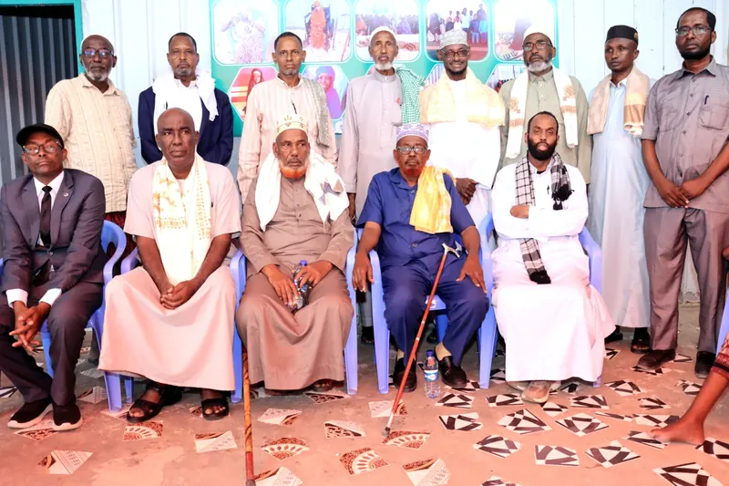 Elders and community members seated together